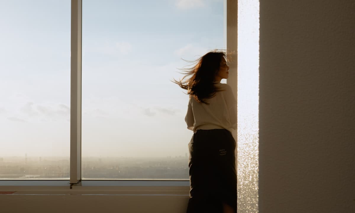 A reflective portrait — someone catching themselves mid-thought